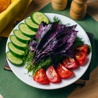 Plate of fresh vegetables and greens