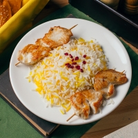 Chicken on skewers with rice